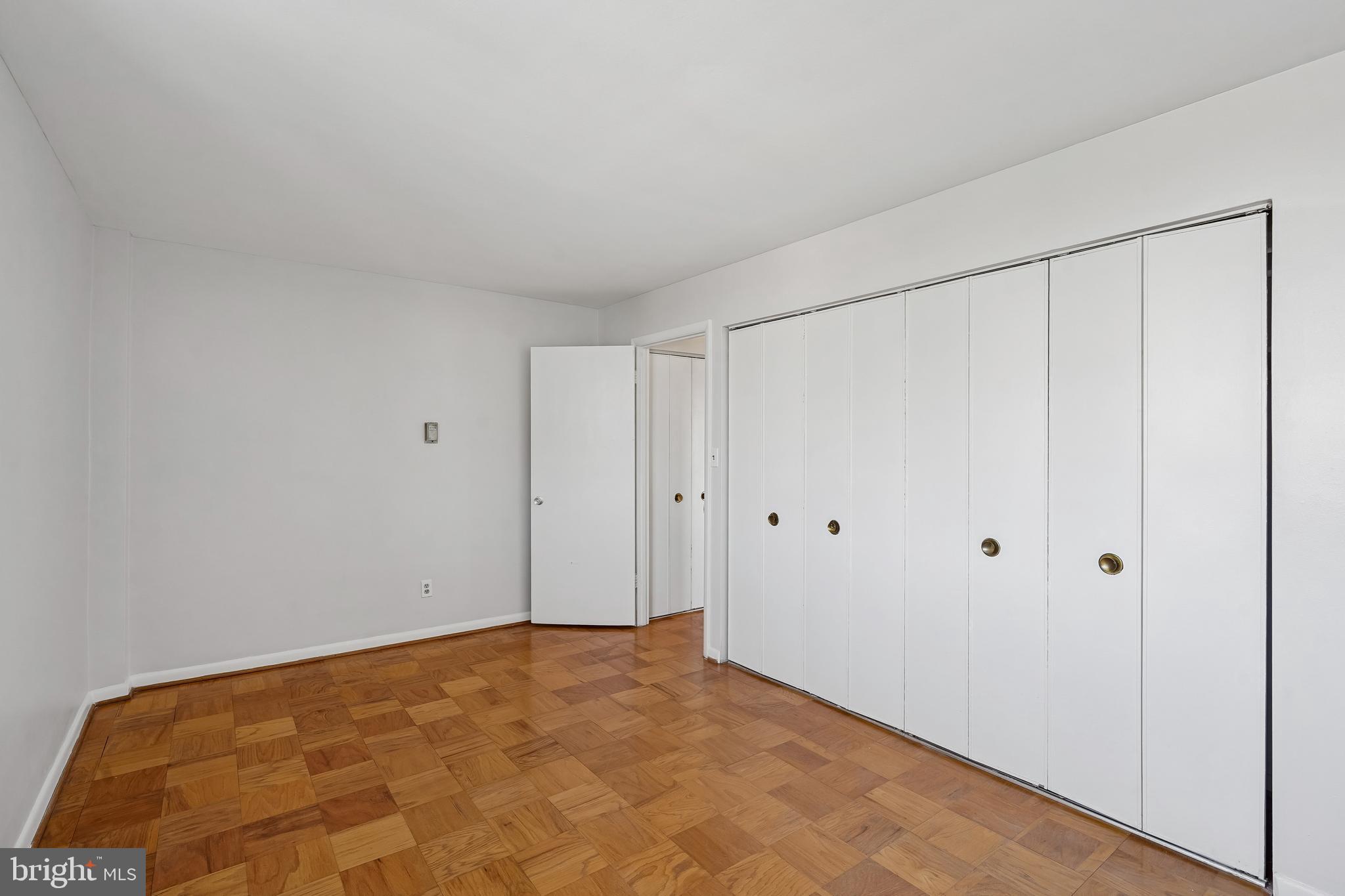 4343 Cherry Hill Road, Unit 705 Arlington, VA 22207 - Photo 29 of 41 Sunlit bedroom with hardwood floors.