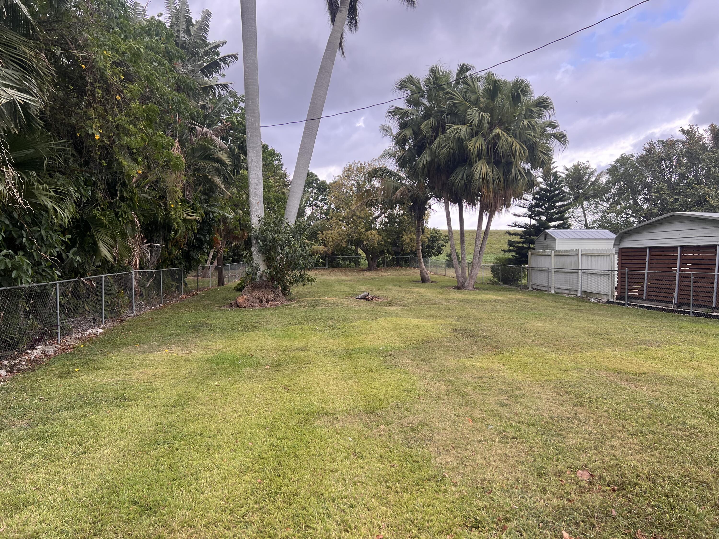 1947 Bacom Point Road Pahokee, FL 33476 - Photo 4 of 11 Backyard