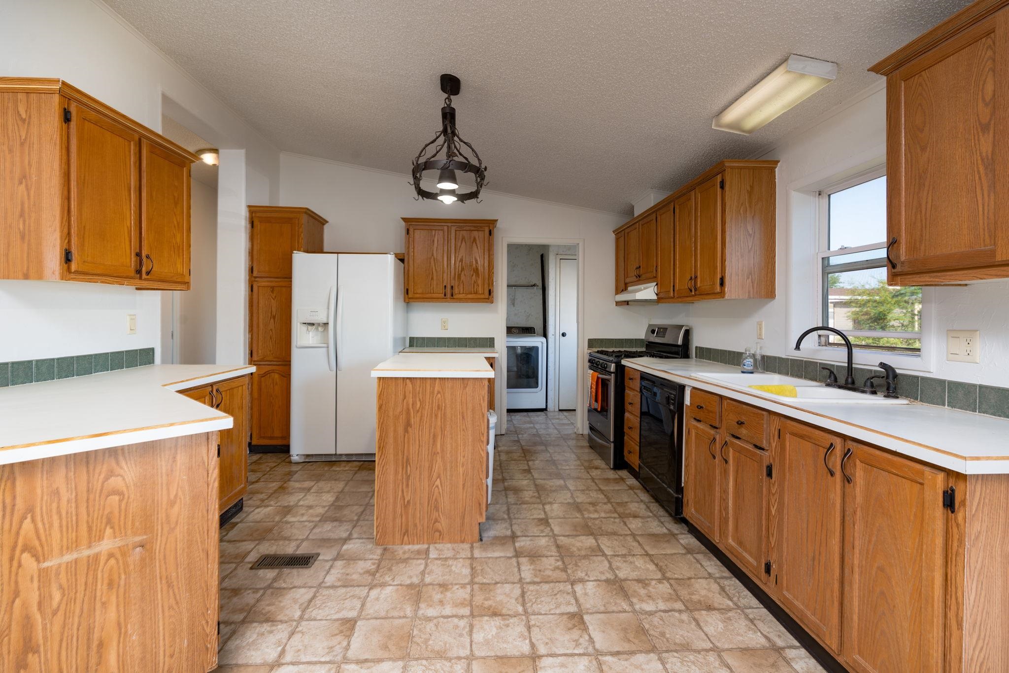 424 32 Road, Unit 284 Clifton, CO 81520 - Photo 13 of 21 a kitchen with sink a refrigerator and cabinets