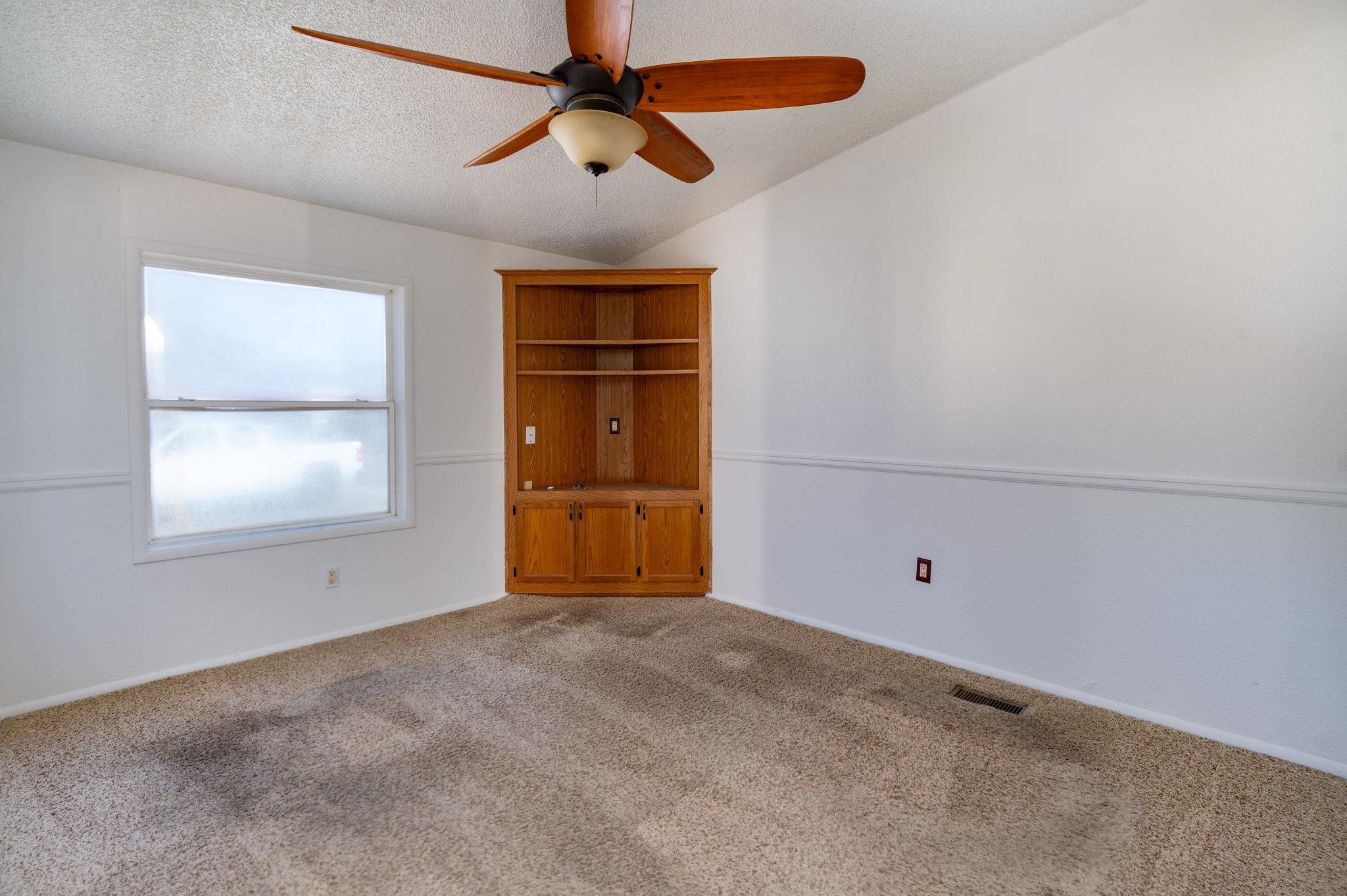 424 32 Road, Unit 284 Clifton, CO 81520 - Photo 16 of 21 an empty room with windows and fan