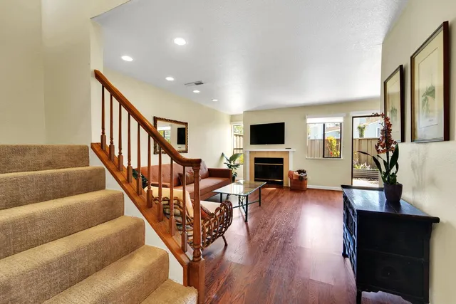 a view of a livingroom with furniture and a flat screen tv