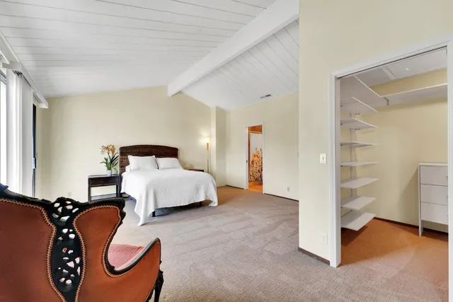 a bedroom with a bed and utility room