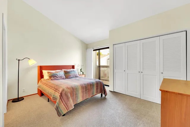 a bedroom with a bed and a closet