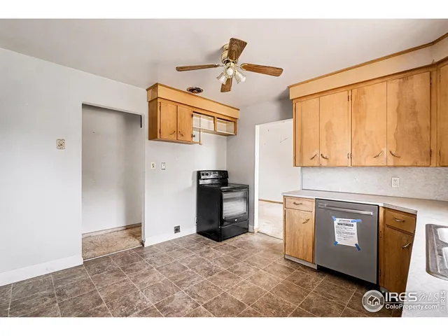 a kitchen with stainless steel appliances kitchen island a refrigerator sink and stove
