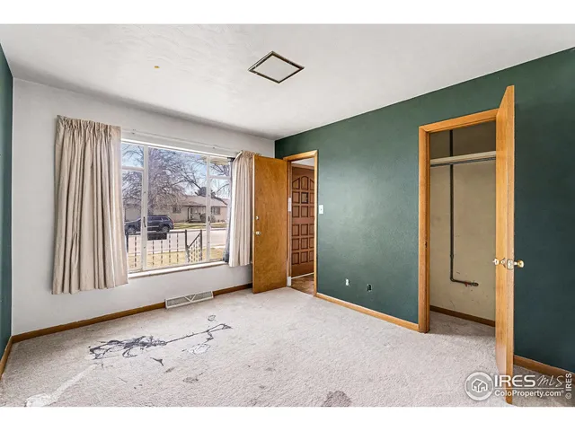 a view of a room with a large window