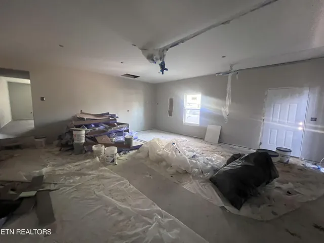 a bed room with a bed and a window