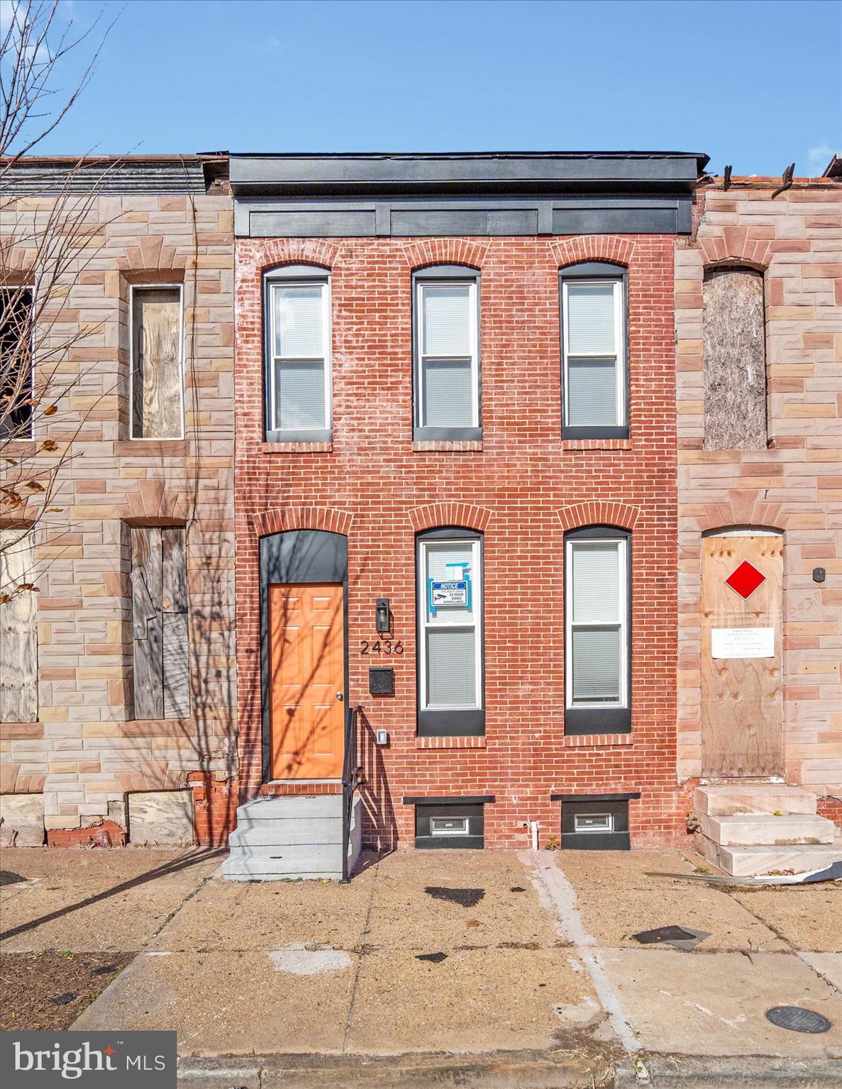 2440 East Biddle Street Baltimore, MD 21213 - Photo 31 of 35 a view of a brick building with many windows
