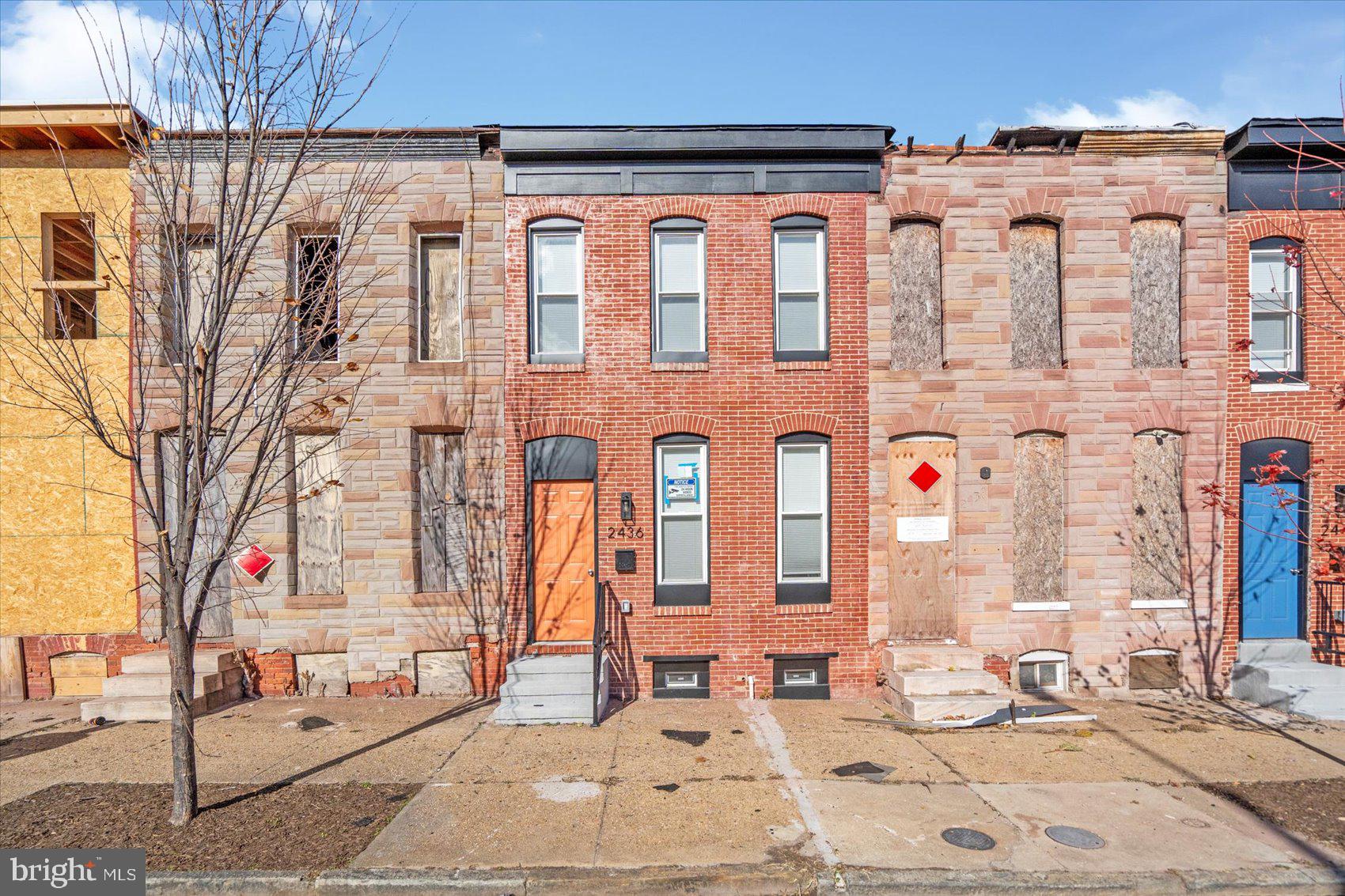 2440 East Biddle Street Baltimore, MD 21213 - Photo 32 of 35 a front view of a building with dining table and chairs