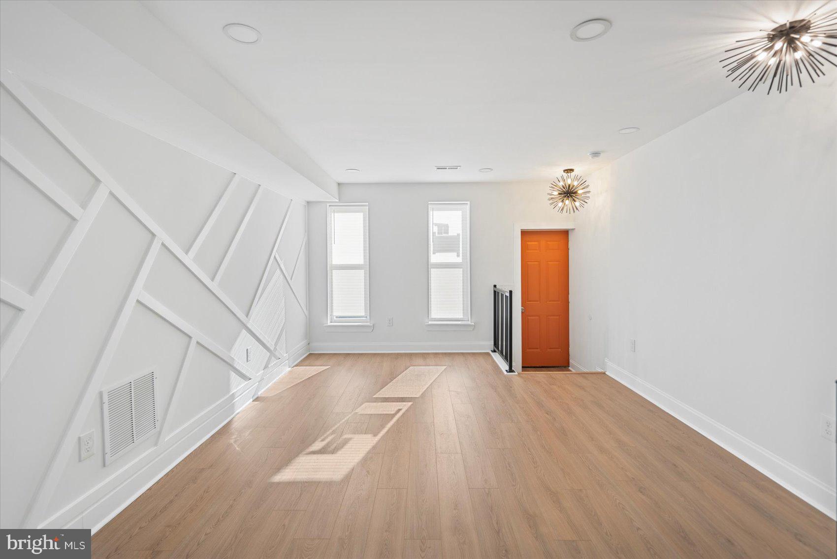 2440 East Biddle Street Baltimore, MD 21213 - Photo 4 of 35 a view of an empty room with a window