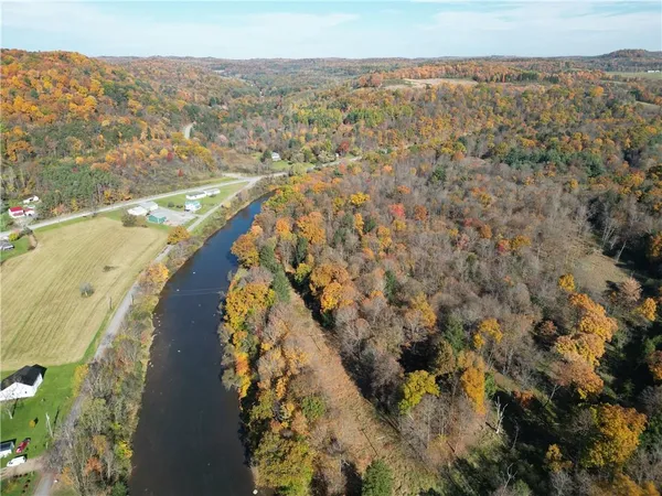 an aerial view of residential house and lake view