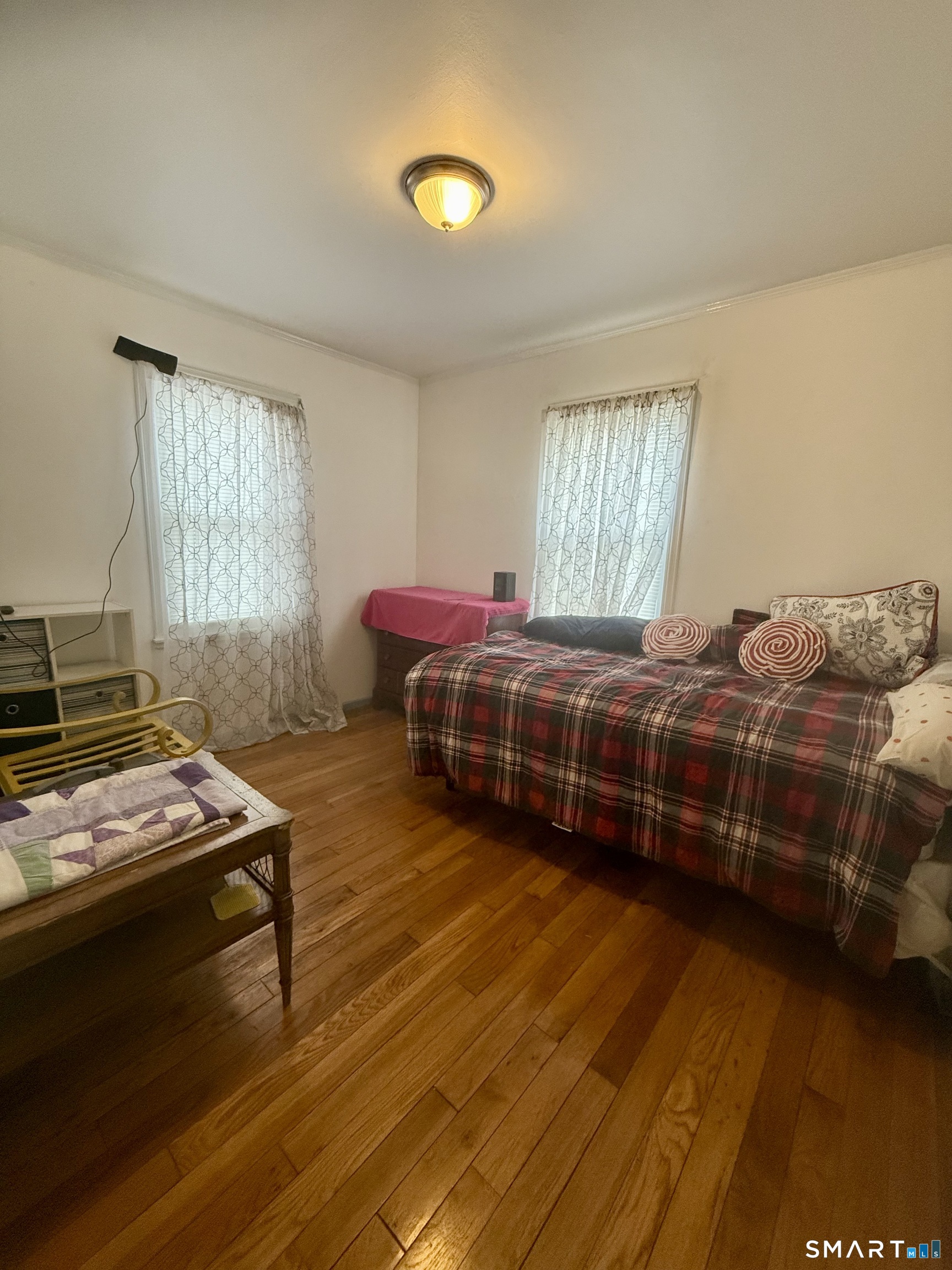 92 Garfield Road Bristol, CT 06010 - Photo 14 of 24 a bedroom with two beds and painting on the wall