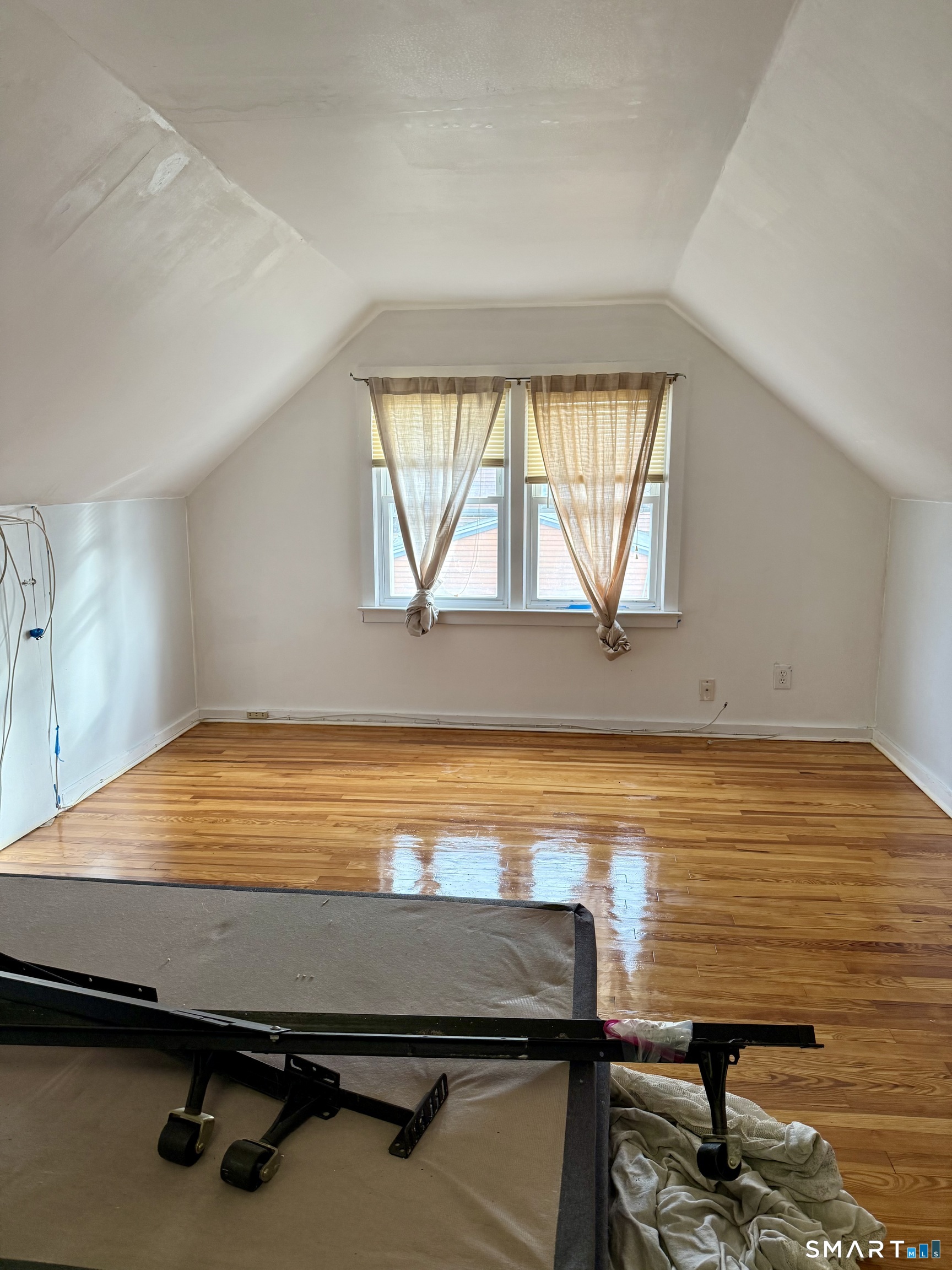92 Garfield Road Bristol, CT 06010 - Photo 17 of 24 a room with wooden floor and window
