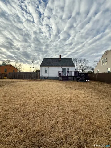 a view of a terrace with wooden fence
