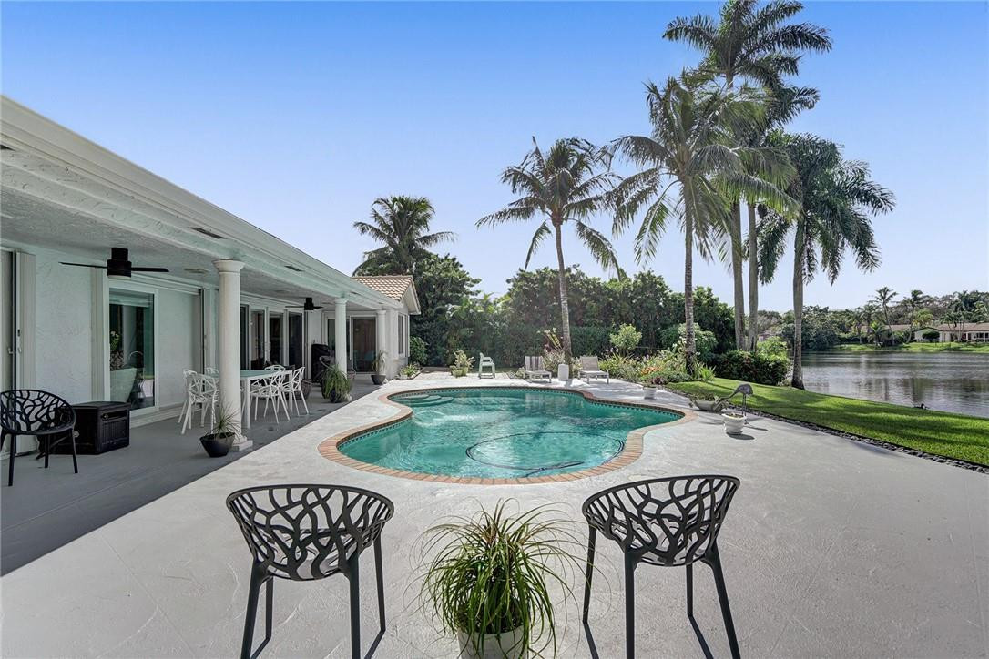 3404 Bridge Road Cooper City, FL 33026 - Photo 66 of 88 a view of a dinning table and chairs in patio