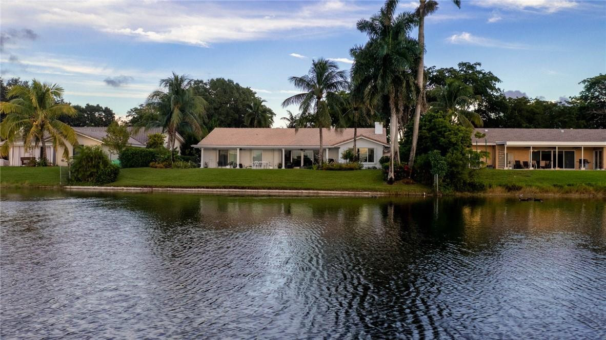3404 Bridge Road Cooper City, FL 33026 - Photo 75 of 88 a view of a lake with houses
