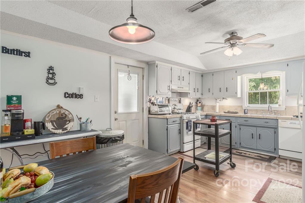 2203 Peeler Road Vale, NC 28168 - Photo 8 of 21 a kitchen with a table and chairs