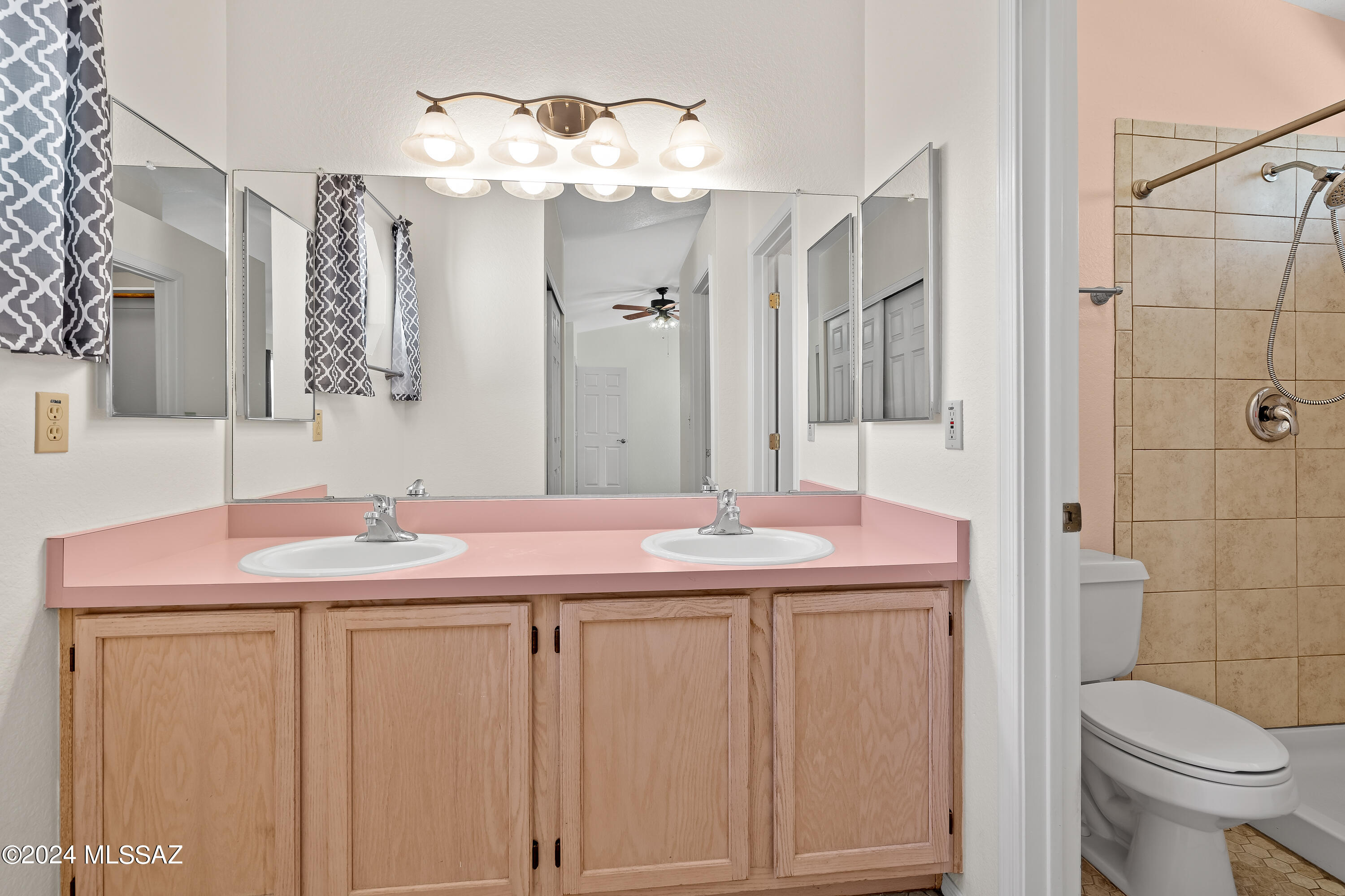 3476 West Sky Ridge Loop Tucson, AZ 85742 - Photo 18 of 31 a bathroom with a sink and a mirror