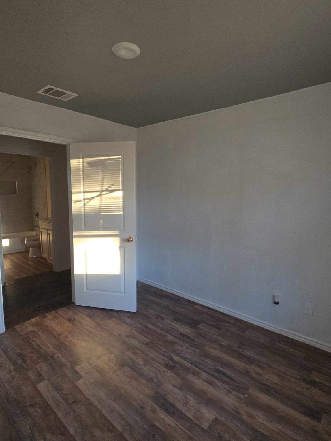 130 Gato Road Cedar Creek, TX 78612 - Photo 8 of 23 Unfurnished room with dark wood-type flooring
