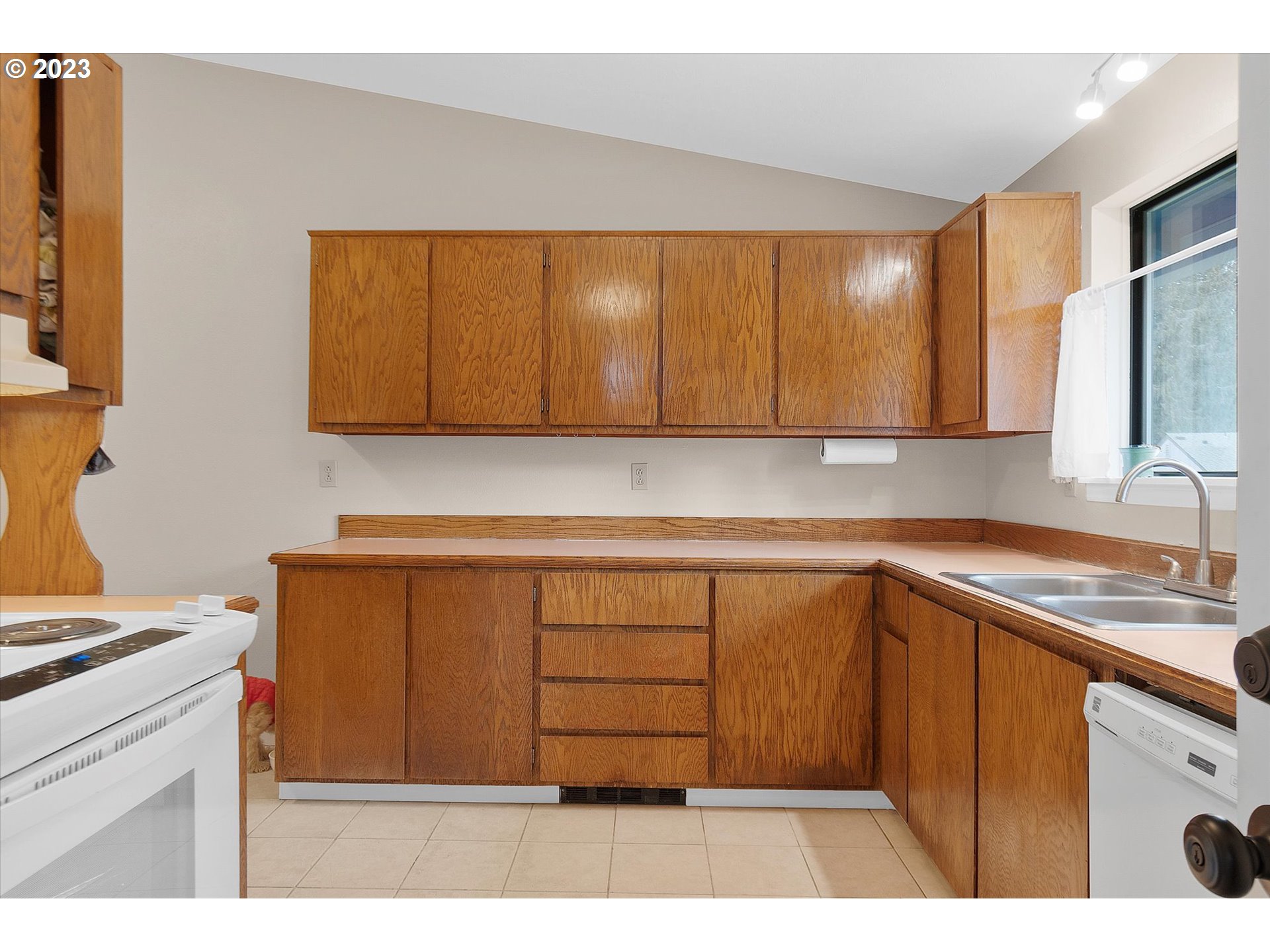39935 Davis Street Sandy, OR 97055 - Photo 12 of 32 a kitchen with a sink cabinets and a stove top oven