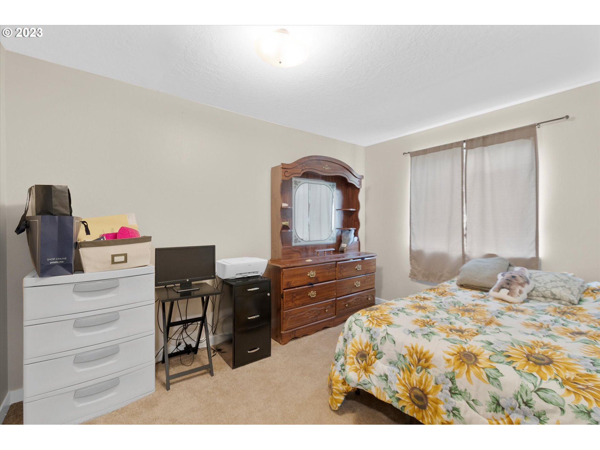 39935 Davis Street Sandy, OR 97055 - Photo 16 of 32 a bedroom with a bed dresser and a dresser