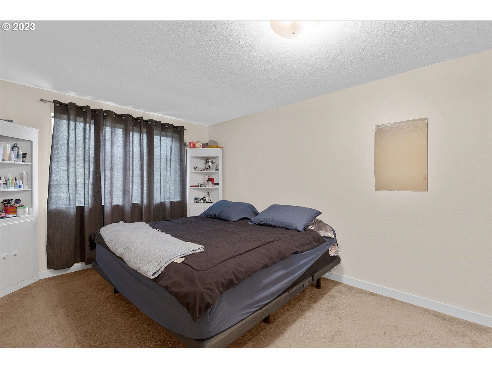 39935 Davis Street Sandy, OR 97055 - Photo 18 of 32 a bed sitting in a spacious bedroom next to a window