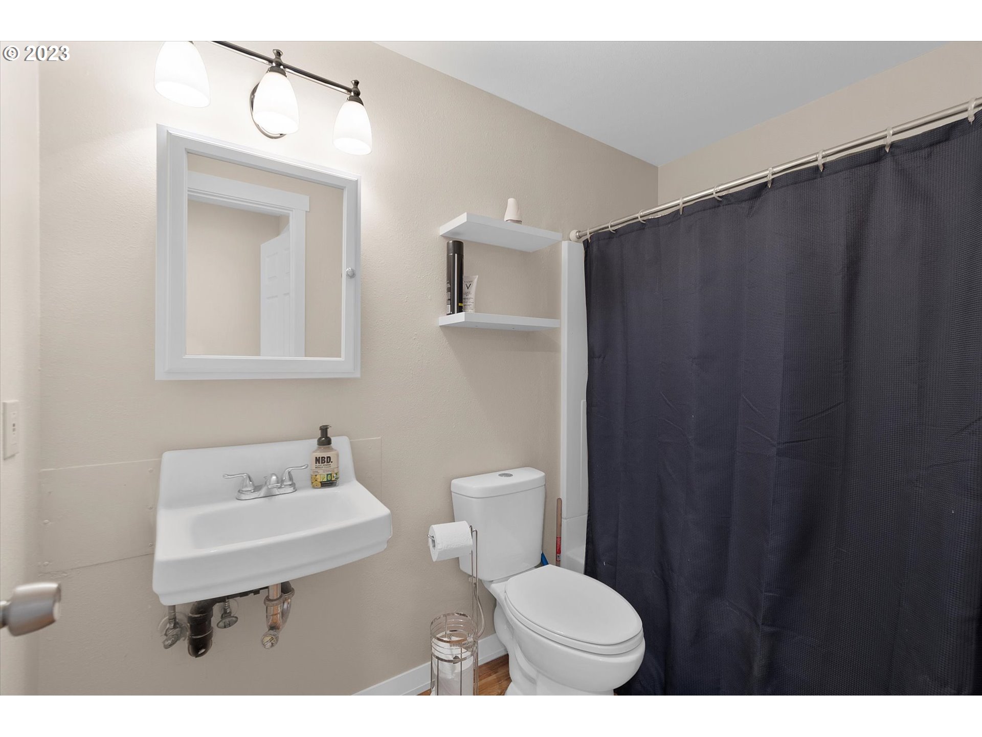 39935 Davis Street Sandy, OR 97055 - Photo 24 of 32 a bathroom with a sink a toilet and mirror
