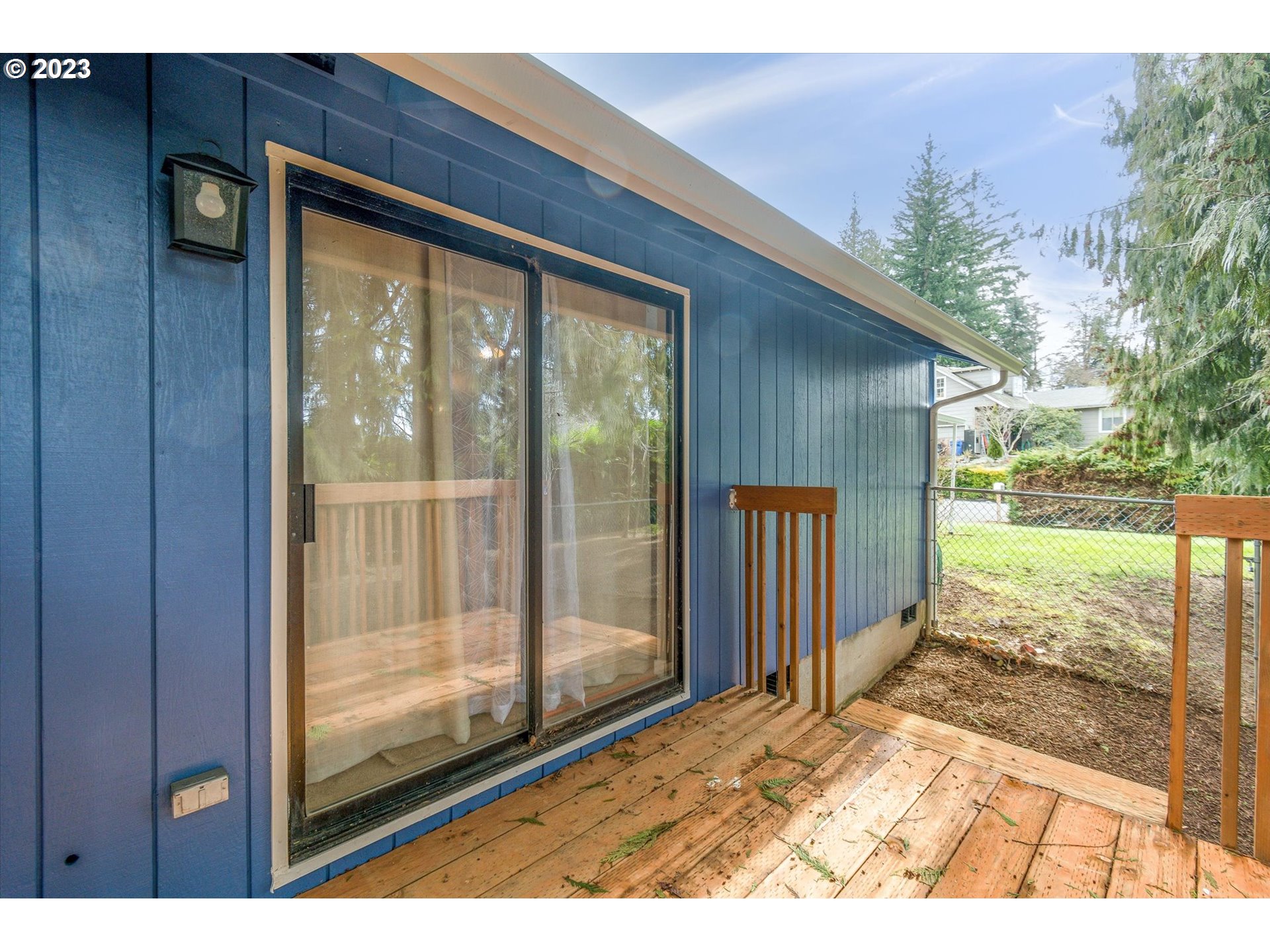 39935 Davis Street Sandy, OR 97055 - Photo 26 of 32 a view of backyard with large trees and wooden fence