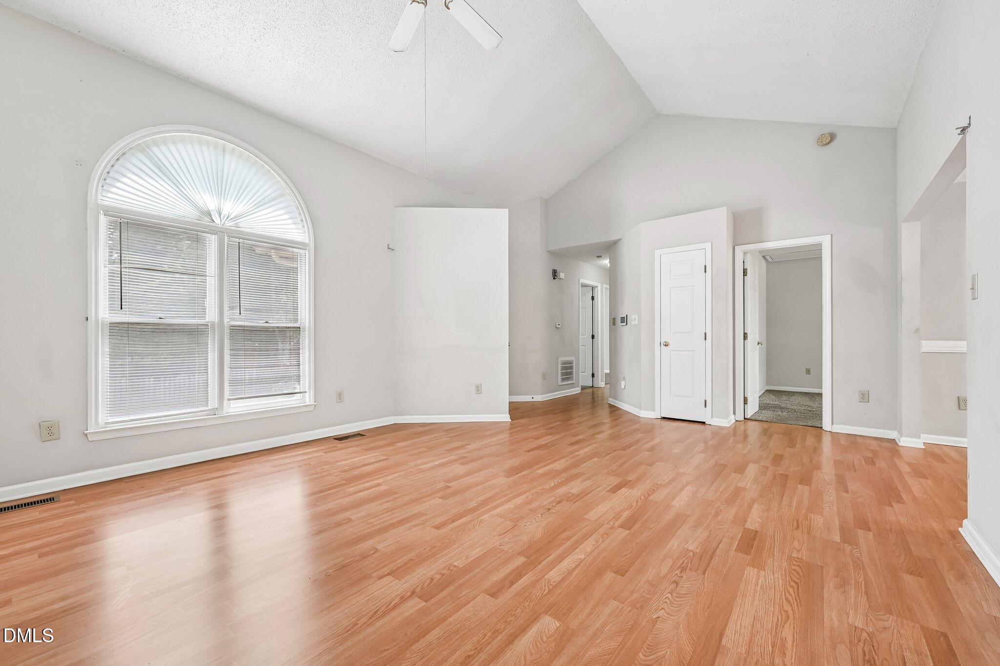 2800 West Jameson Road Raleigh, NC 27604 - Photo 5 of 24 a view of empty room with wooden floor and fan