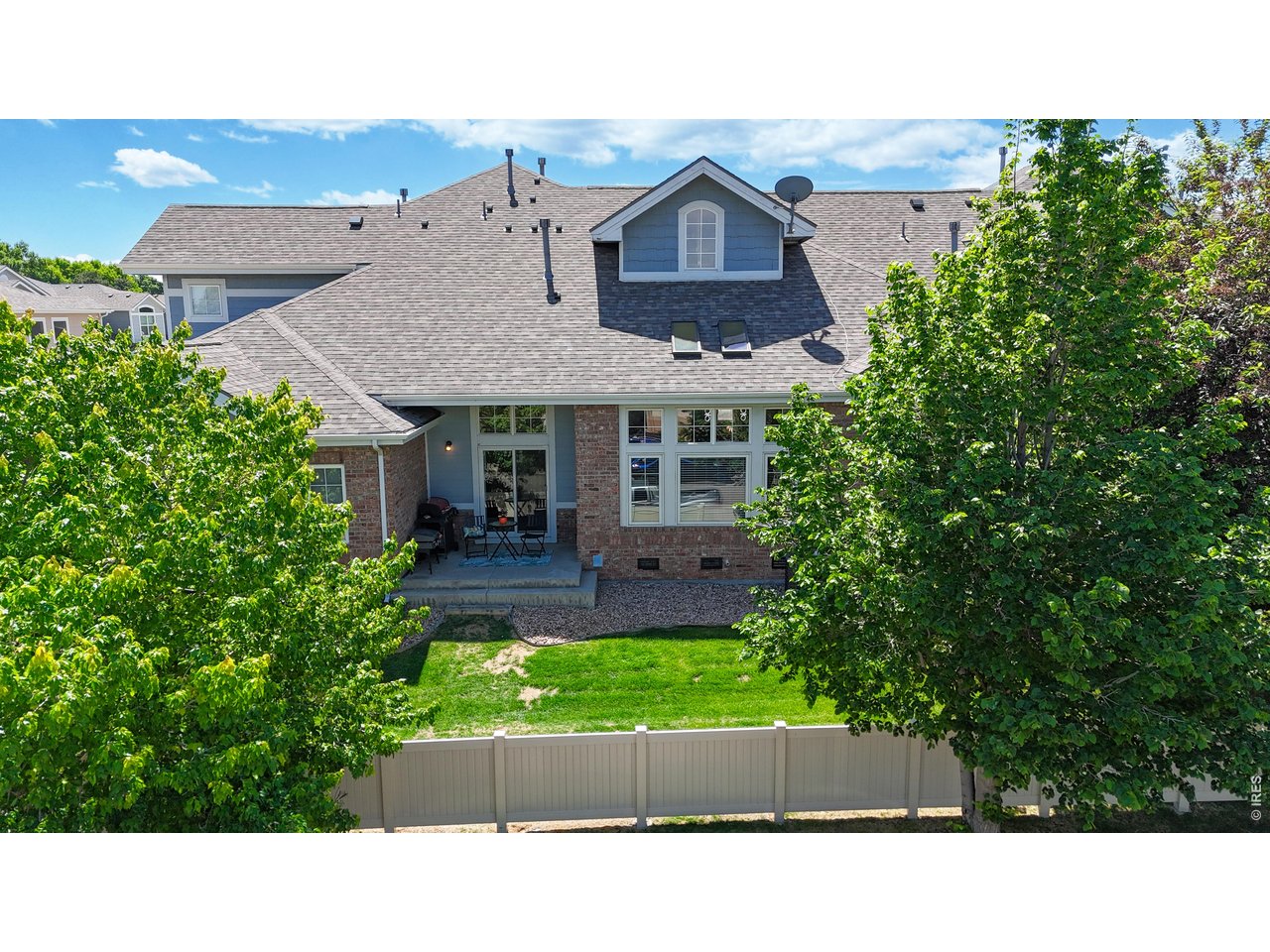 4672 West 20th Road, Unit 413 Greeley, CO 80634 - Photo 36 of 37 a aerial view of a house with a yard