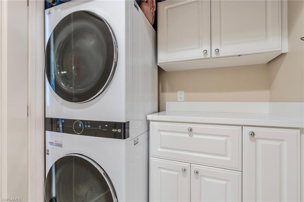 9115 Strada Place, Unit 5317 Naples, FL 34108 - Photo 13 of 30 a utility room with dryer and washer