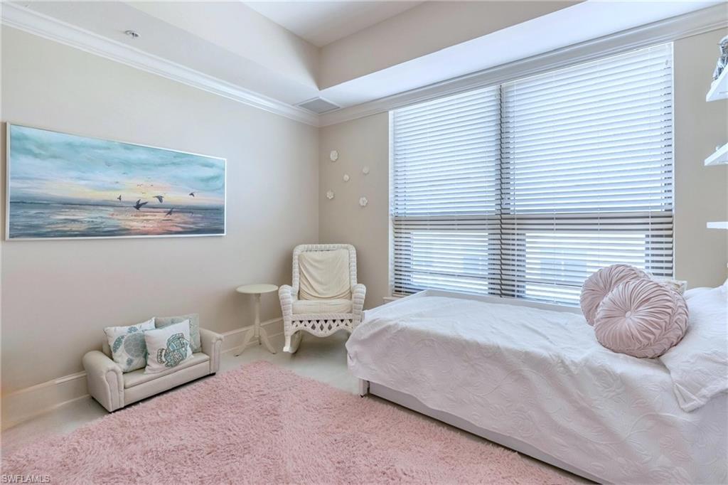 9115 Strada Place, Unit 5317 Naples, FL 34108 - Photo 14 of 30 a bedroom with a bed and a window