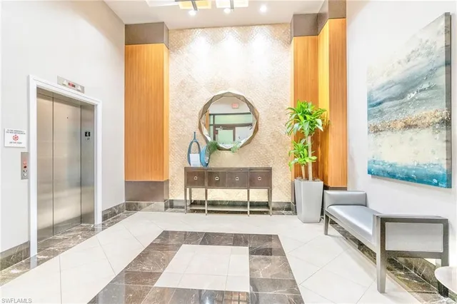 a view of roof deck with couches and potted plants