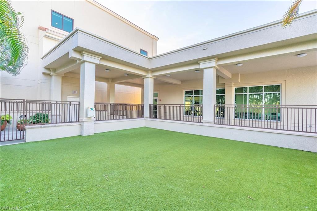 9115 Strada Place, Unit 5317 Naples, FL 34108 - Photo 30 of 30 a view of a house with a swimming pool and a porch