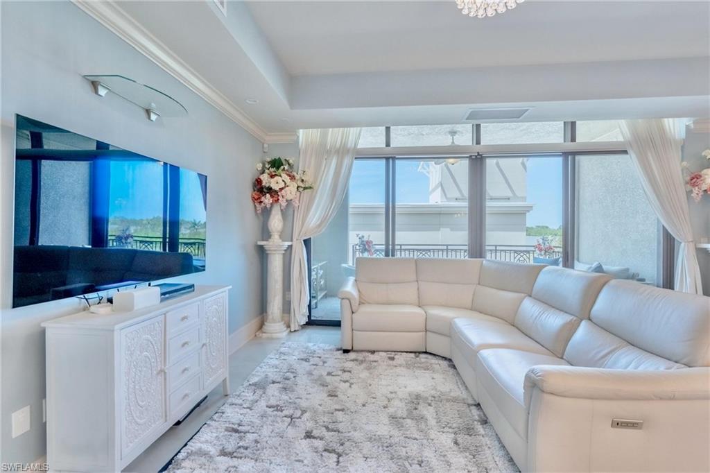 9115 Strada Place, Unit 5317 Naples, FL 34108 - Photo 4 of 30 a living room with furniture and a large window