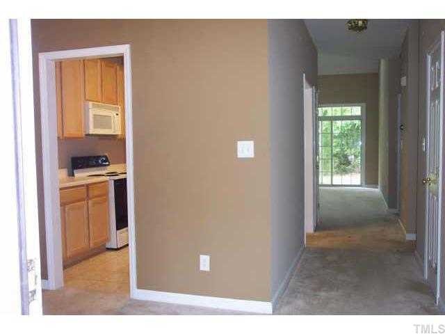 3036 Coxindale Drive Raleigh, NC 27615 - Photo 8 of 10 a kitchen with white cabinets and sink