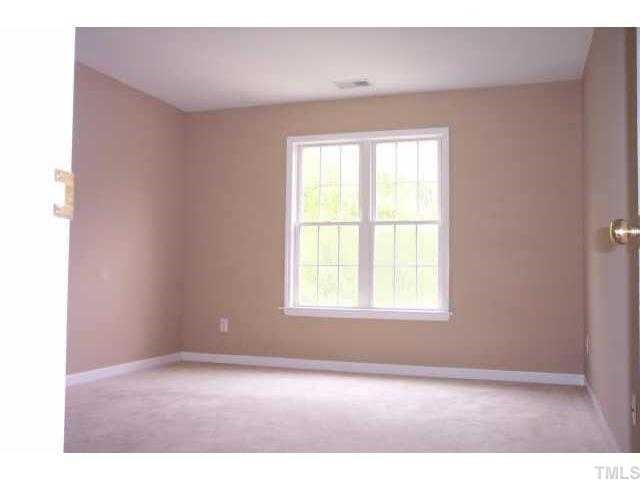 3036 Coxindale Drive Raleigh, NC 27615 - Photo 10 of 10 a view of an empty room with a window