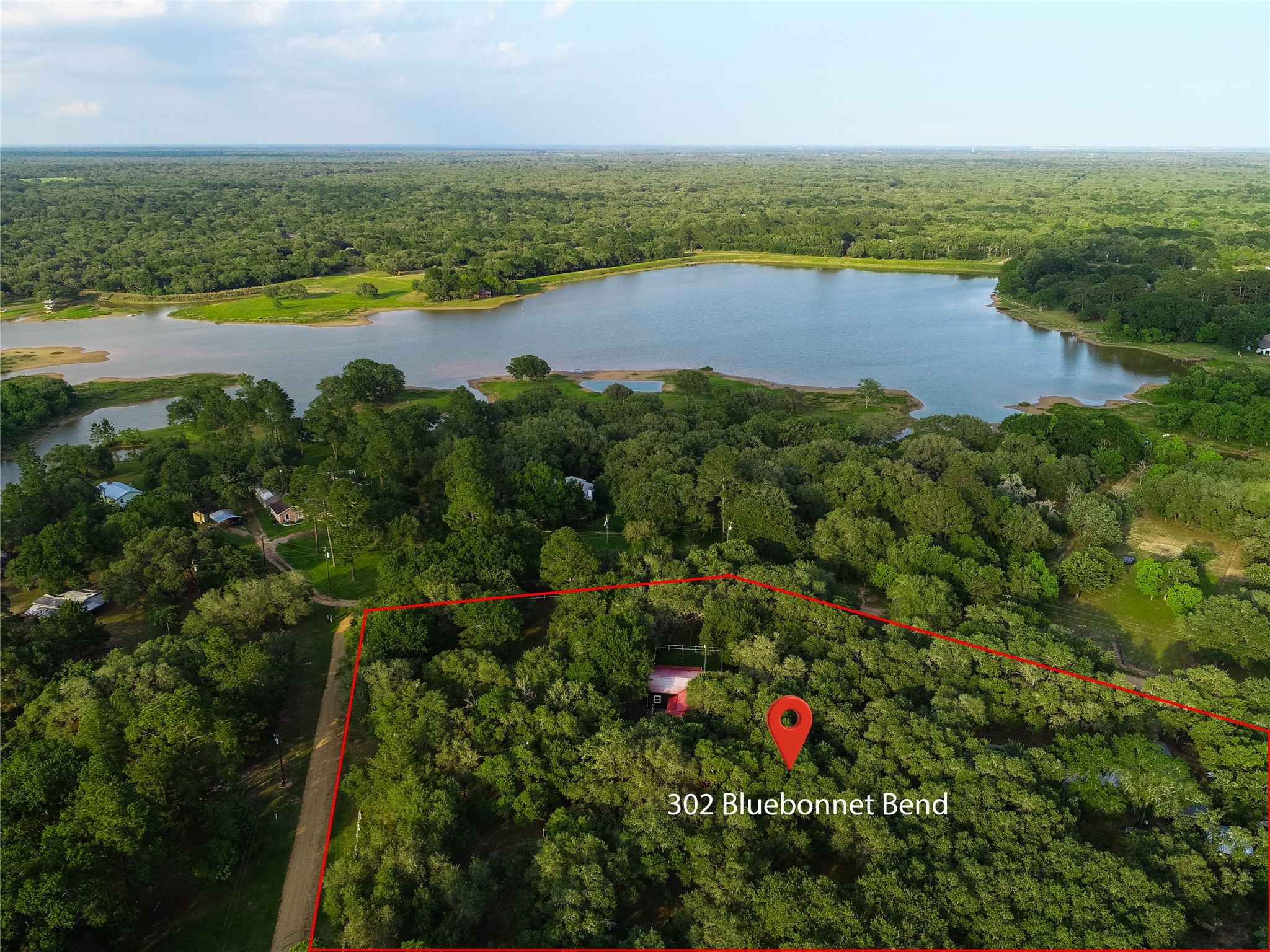an aerial view of residential houses with outdoor space and swimming pool