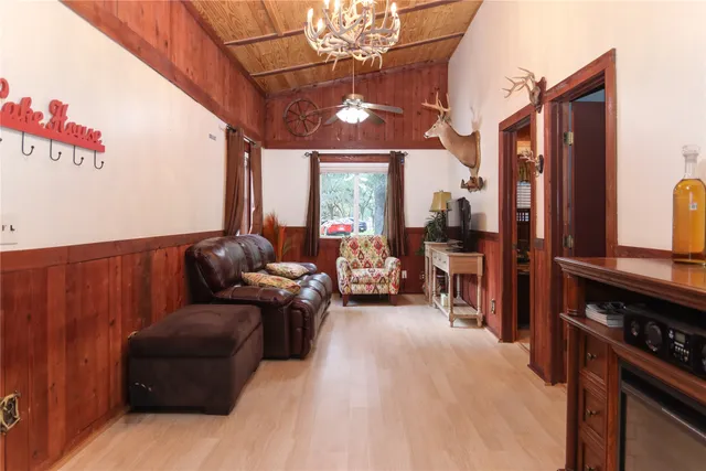 a bed room with a bed and a chandelier