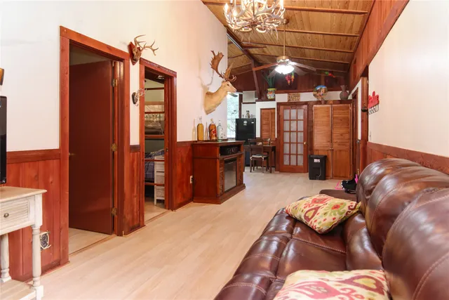 a kitchen with granite countertop a stove a sink and a refrigerator