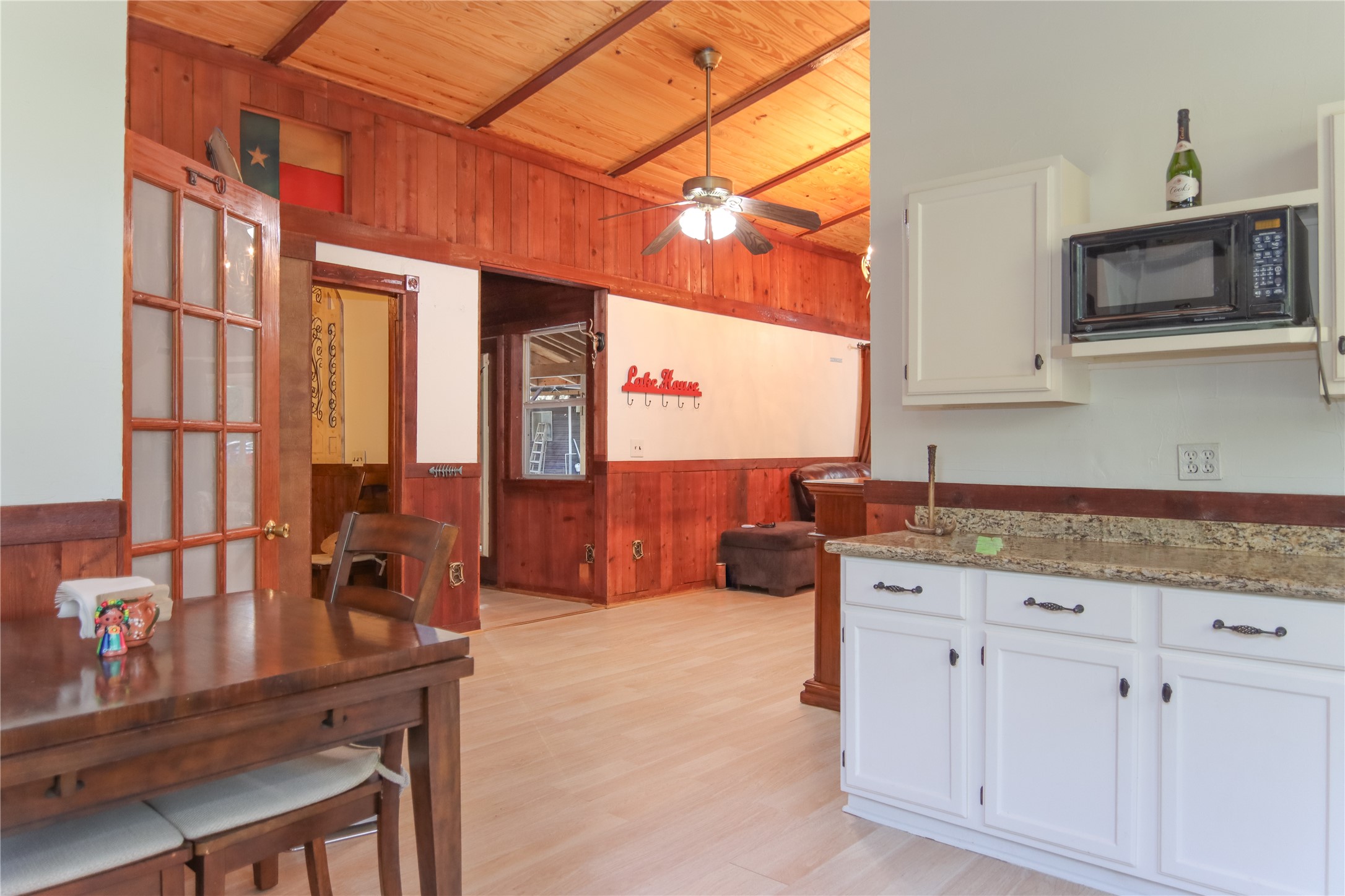 302 Bluebonnet Bend Sheridan, TX 77475 - Photo 21 of 29 a kitchen with granite countertop a sink and cabinets