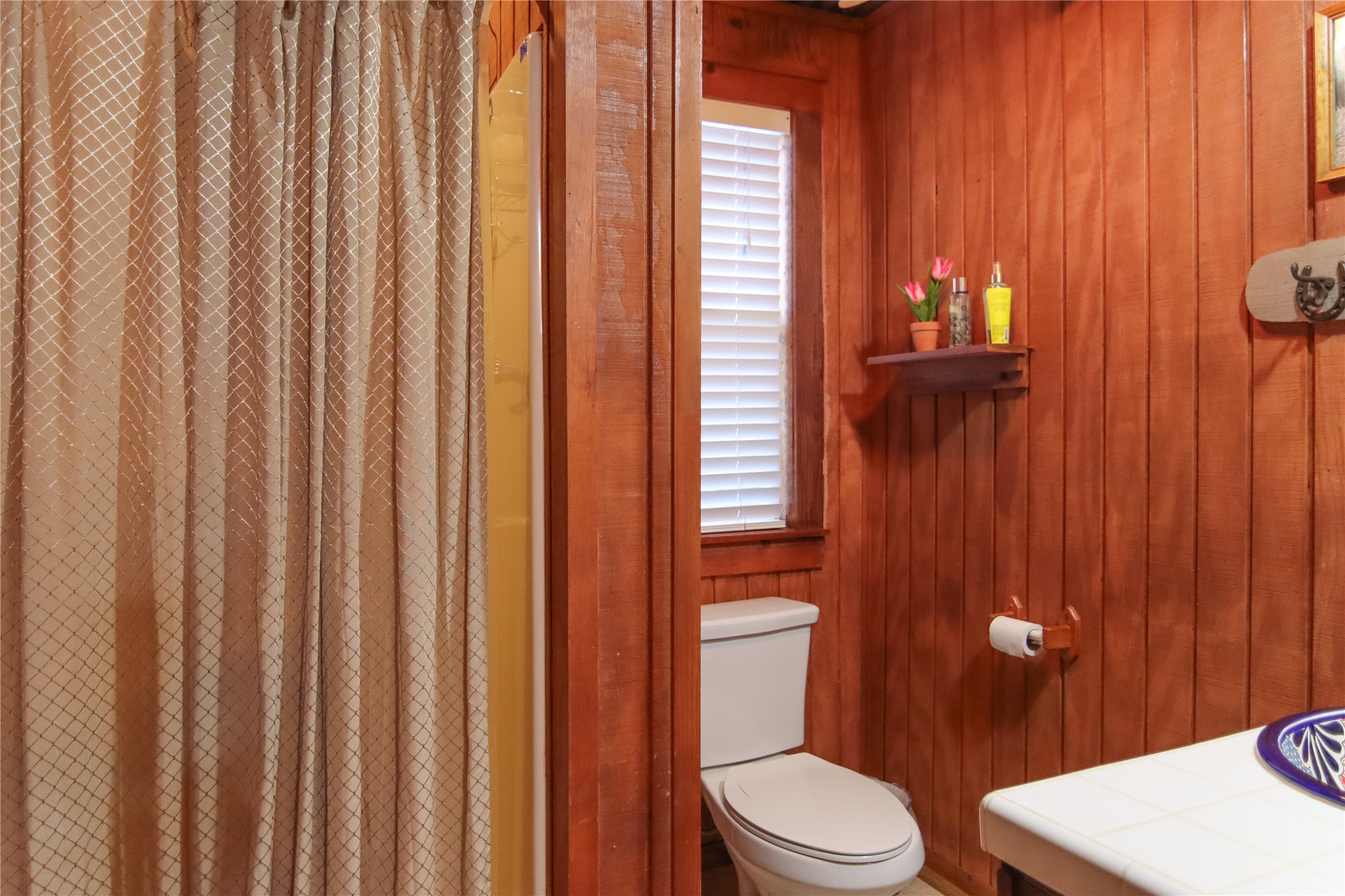 302 Bluebonnet Bend Sheridan, TX 77475 - Photo 22 of 29 a white toilet sitting next to a bathroom sink