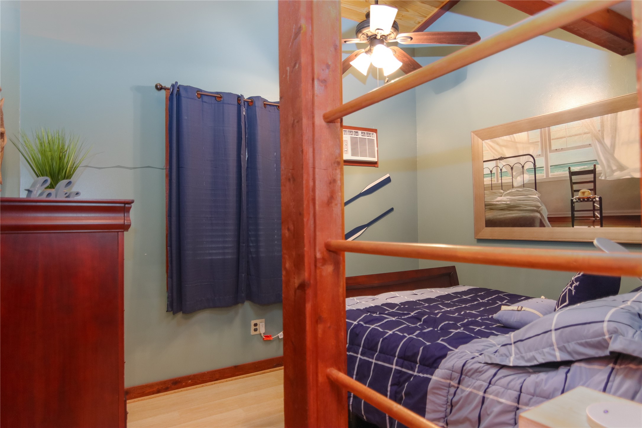 302 Bluebonnet Bend Sheridan, TX 77475 - Photo 27 of 29 a bedroom with a bed and a dresser