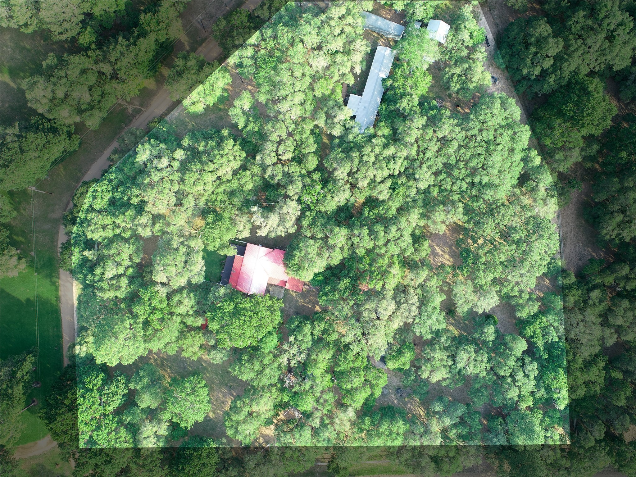 302 Bluebonnet Bend Sheridan, TX 77475 - Photo 4 of 29 a backyard of a house with a yard and outdoor seating