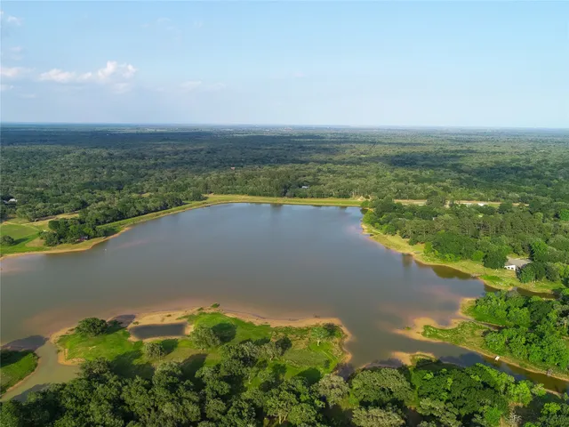 a view of a lake with a yard