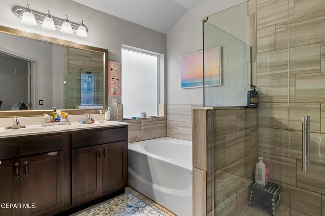 a bathroom with a double vanity sink mirror and double