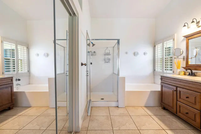 a bathroom with a bathtub and a shower