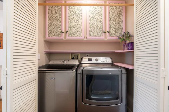 a view of washer and dryer sitting on a shelf