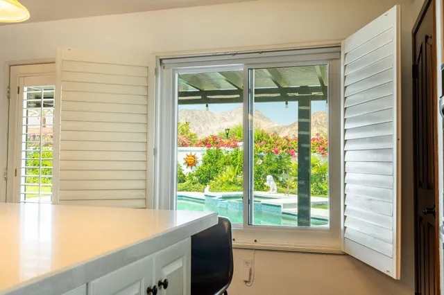 a view of a room that has a large window