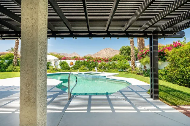 a view of swimming pool with patio
