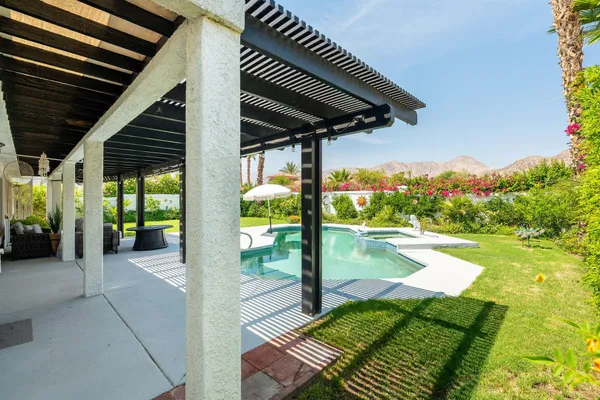 a view of swimming pool with a patio